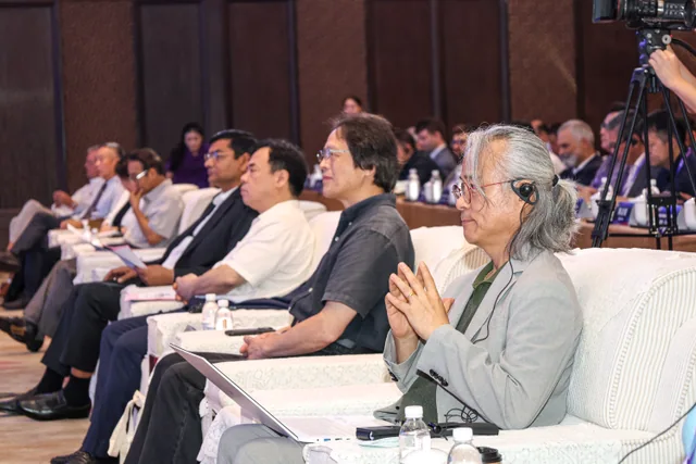 An international audience listening to conference speakers