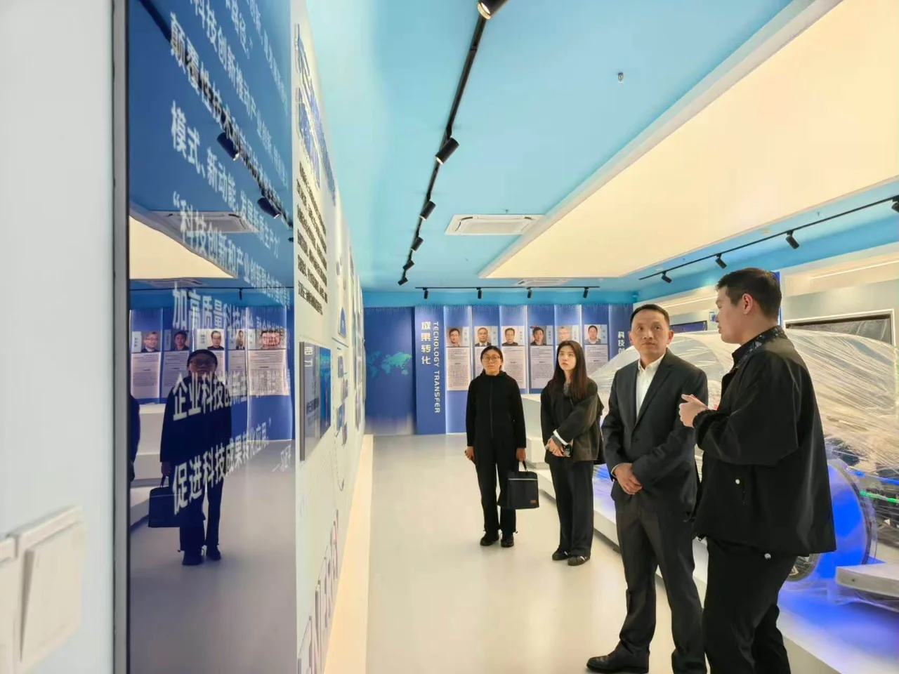 A group exploring displays during a technology showroom visit